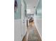 Bright hallway with wood floors, leading to various rooms, enhancing the home's modern design at 212 2Nd Ave. N # 364, North Myrtle Beach, SC 29582
