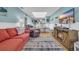Open-concept living room features a fireplace, hardwood floors, dining room and kitchen access at 212 2Nd Ave. N # 364, North Myrtle Beach, SC 29582