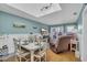 Living room with dining table, hardwood floors, skylight and adjacent patio access at 212 2Nd Ave. N # 364, North Myrtle Beach, SC 29582