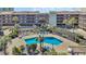 Refreshing community pool with inviting blue lounge chairs and lush landscaping at 212 2Nd Ave. N # 364, North Myrtle Beach, SC 29582