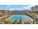 Community tennis courts nestled between buildings with lush landscaping at 212 2Nd Ave. N # 364, North Myrtle Beach, SC 29582