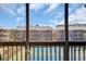 View from window overlooking tennis courts, community buildings, and beautiful clear sky at 212 2Nd Ave. N # 364, North Myrtle Beach, SC 29582