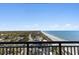 Breathtaking ocean view from balcony with long sandy beach, pool, and coastal homes at 3000 N Ocean Blvd. # 1601, Myrtle Beach, SC 29577