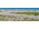 Expansive sandy beach with beachgoers enjoying the sun and surf in this oceanfront community at 3000 N Ocean Blvd. # 1601, Myrtle Beach, SC 29577