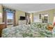 Sunny bedroom with two beds, tropical bedding, dresser, and a scenic outdoor view at 3000 N Ocean Blvd. # 1601, Myrtle Beach, SC 29577