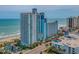 A stunning multi-story condo with ocean views, a pool, and beautiful landscaping at 3000 N Ocean Blvd. # 1601, Myrtle Beach, SC 29577