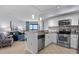 Modern kitchen with stainless steel appliances, granite countertops, and an open layout to the living area at 3000 N Ocean Blvd. # 1601, Myrtle Beach, SC 29577