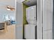 Convenient laundry closet includes stacked washer and dryer with an open view of living space at 3000 N Ocean Blvd. # 1601, Myrtle Beach, SC 29577