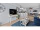 Spacious living area featuring a TV, modern furniture, and an eat-in kitchen with barstool seating at 3000 N Ocean Blvd. # 1601, Myrtle Beach, SC 29577