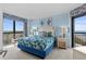 Comfortable bedroom with floral bedding, ocean views, and ample natural light at 3000 N Ocean Blvd. # 1601, Myrtle Beach, SC 29577