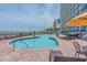 Inviting outdoor pool area with lounge chairs and ocean views at this wonderful resort at 3000 N Ocean Blvd. # 1601, Myrtle Beach, SC 29577