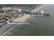 Aerial view featuring Garden City Pier, entertainment district, and 328 South Waccamaw Drive at 328 S Waccamaw Dr., Garden City Beach, SC 29576
