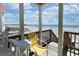 Balcony with beach view featuring outdoor seating and access to the sand at 328 S Waccamaw Dr., Garden City Beach, SC 29576