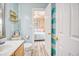 Bright bathroom featuring modern fixtures and beachy decor, with view to bedroom at 328 S Waccamaw Dr., Garden City Beach, SC 29576