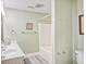 Well-lit bathroom features a clean design with neutral tones, new fixtures, and walk in shower at 328 S Waccamaw Dr., Garden City Beach, SC 29576