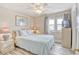 Cozy bedroom with a queen-sized bed, soft lighting, and comfortable decor at 328 S Waccamaw Dr., Garden City Beach, SC 29576