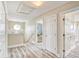 Hallway leads to bedrooms, showcasing the home's layout and ample natural light at 328 S Waccamaw Dr., Garden City Beach, SC 29576