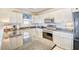 Updated kitchen featuring granite countertops, modern appliances, and ample cabinet space at 328 S Waccamaw Dr., Garden City Beach, SC 29576