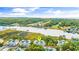 Aerial view featuring waterway condos, golf course, and coastline, marked with a locator pin at 4430 Turtle Ln. # 2-C, Little River, SC 29566