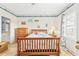 Cozy bedroom featuring beach-themed decor, hardwood floors, and a bright, airy atmosphere at 4430 Turtle Ln. # 2-C, Little River, SC 29566