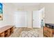 This bedroom offers a closet, lighting and wood flooring at 4430 Turtle Ln. # 2-C, Little River, SC 29566