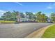 Welcoming entrance to Eastport Golf Community, featuring lush landscaping and a serene atmosphere at 4430 Turtle Ln. # 2-C, Little River, SC 29566