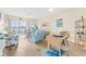 Cozy living room with sliding glass doors to balcony, coastal decor, and wood-look flooring at 4430 Turtle Ln. # 2-C, Little River, SC 29566