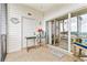 Cozy screened porch with seating provides a relaxing waterfront view at 4430 Turtle Ln. # 2-C, Little River, SC 29566
