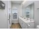 Well-lit bathroom featuring double sinks and a large mirror at 9772 Leyland Dr. # 9772-9, Myrtle Beach, SC 29572