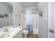 This bathroom has a shower and tub with a grey and blue curtain at 9772 Leyland Dr. # 9772-9, Myrtle Beach, SC 29572