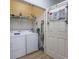 Functional laundry room with washer, dryer, storage shelves and drying rack at 9772 Leyland Dr. # 9772-9, Myrtle Beach, SC 29572