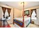 Bedroom with a large four-poster bed and artwork at 3149 Bramble Glen Dr., Myrtle Beach, SC 29579