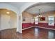 Formal dining room with hardwood floors and burgundy accent wall at 3149 Bramble Glen Dr., Myrtle Beach, SC 29579