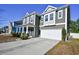 Two-story house with gray siding, stone accents, and a two-car garage at 3149 Bramble Glen Dr., Myrtle Beach, SC 29579