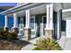 Front porch with stone pillars and a welcome sign at 3149 Bramble Glen Dr., Myrtle Beach, SC 29579