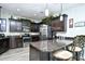 Spacious kitchen featuring dark cabinetry and a breakfast bar at 3149 Bramble Glen Dr., Myrtle Beach, SC 29579