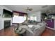 Living room with sectional sofa, fireplace, and hardwood floors at 3149 Bramble Glen Dr., Myrtle Beach, SC 29579