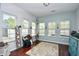 Sunroom with multiple windows and hardwood floors at 3149 Bramble Glen Dr., Myrtle Beach, SC 29579