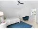 Bright bedroom featuring a vaulted ceiling, white walls, blue rug and adjacent sitting area at 5800 Creekside Dr., Myrtle Beach, SC 29588