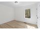 This empty bedroom features light walls, wood flooring and a window looking outdoors at 5800 Creekside Dr., Myrtle Beach, SC 29588