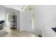 Bright entryway showcases a modern interior, featuring a white front door with sidelight and decorative shelf at 5800 Creekside Dr., Myrtle Beach, SC 29588