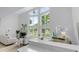 Bright open-concept living room showcasing high ceilings, fireplace, natural light and a stylish, inviting atmosphere at 5800 Creekside Dr., Myrtle Beach, SC 29588