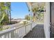 Inviting outdoor space with dark wood floors and white railings, offering neighborhood views at 5800 Creekside Dr., Myrtle Beach, SC 29588