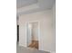 Bedroom entrance featuring carpet, light walls, and white door at 3046 Deerberry Place, Longs, SC 29568