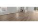 Open-concept living area with bright kitchen, stainless steel appliances and wood-look flooring at 68 Cape Point Dr., Conway, SC 29527