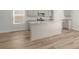 Modern kitchen featuring a central island with granite countertops, a sink, and ample cabinet space for storage at 68 Cape Point Dr., Conway, SC 29527
