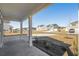 Inviting covered front porch with white columns, offering a relaxing view of the new homes in the neighborhood at 68 Cape Point Dr., Conway, SC 29527