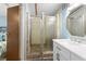 Bright bathroom featuring walk-in shower, vanity with sink, modern fixtures, and decorative mirror at 6001-Mh107 S Kings Hwy., Myrtle Beach, SC 29575