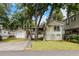 Charming home with a detached garage, driveway, and a well-maintained lawn, enhanced by a pink flamingo statue at 6001-Mh107 S Kings Hwy., Myrtle Beach, SC 29575