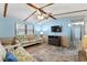 Cozy living room featuring wood-look floors, exposed beam ceiling, and comfortable seating, offering a relaxed living space at 6001-Mh107 S Kings Hwy., Myrtle Beach, SC 29575